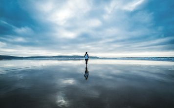 Raise your Vibration – Inspiring photography of person on body of water during daytime