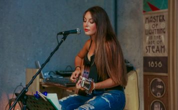 Raise your Vibration – songs woman playing guitar while singing