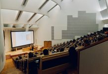 Ishwar Puri people sitting on chair in front of computer