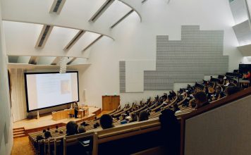 Ishwar Puri people sitting on chair in front of computer