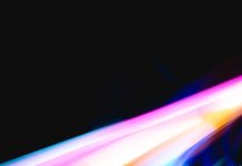 Discover Your Light & Sound Frequency to Heal by Celestial White Beings– Natalie Glasson a blurry photo of a cell phone with a blurry background