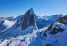 Omnipresence by Archangel Metatron – Natalie Glasson Snow-covered mountains dominate a crisp, blue landscape.