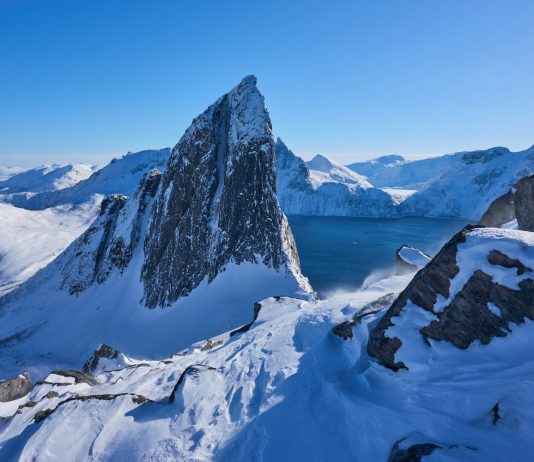Omnipresence by Archangel Metatron – Natalie Glasson Snow-covered mountains dominate a crisp, blue landscape.